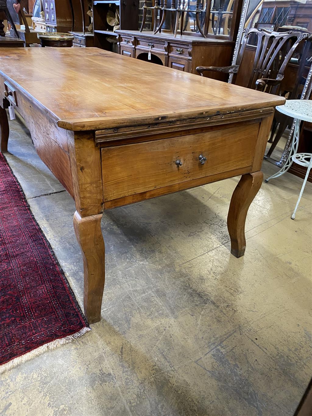 A 19th century French fruitwood hunt table, length 206cm, width 90cm, height 80cm